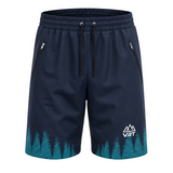 Navy blue athletic shorts with a teal pine tree pattern along the hem, featuring a white VRT logo on the lower right leg and black drawstrings.